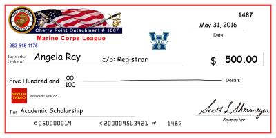 image of large-scale mock check presented to previous scholarship recipient, Angela Ray